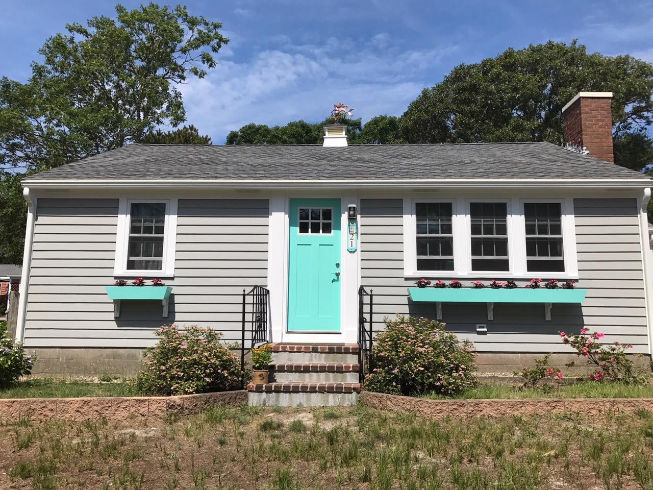 21 Naushon Road Dennis Port, MA 02639 - Photo 27 of 27 a front view of a house with garden