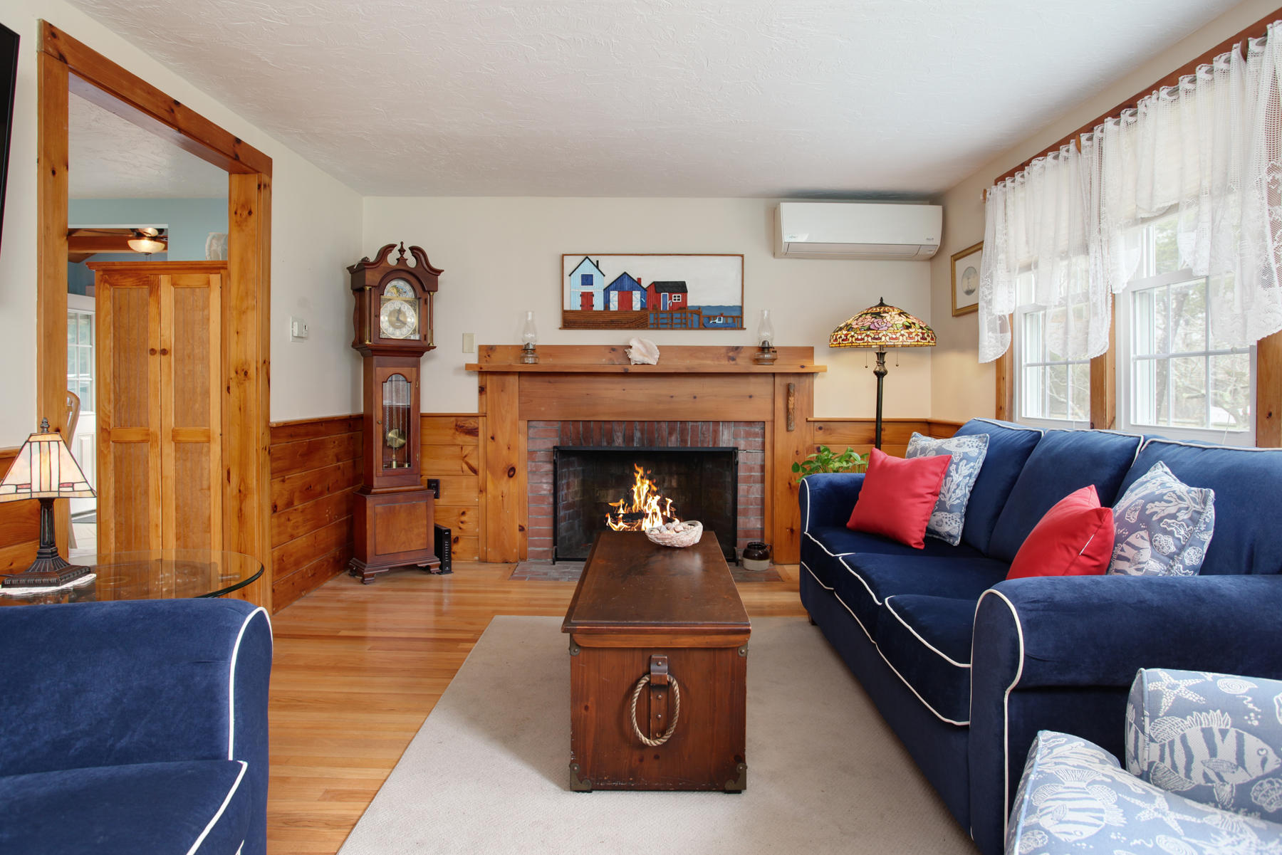 21 Naushon Road Dennis Port, MA 02639 - Photo 4 of 27 a living room with furniture and a fireplace