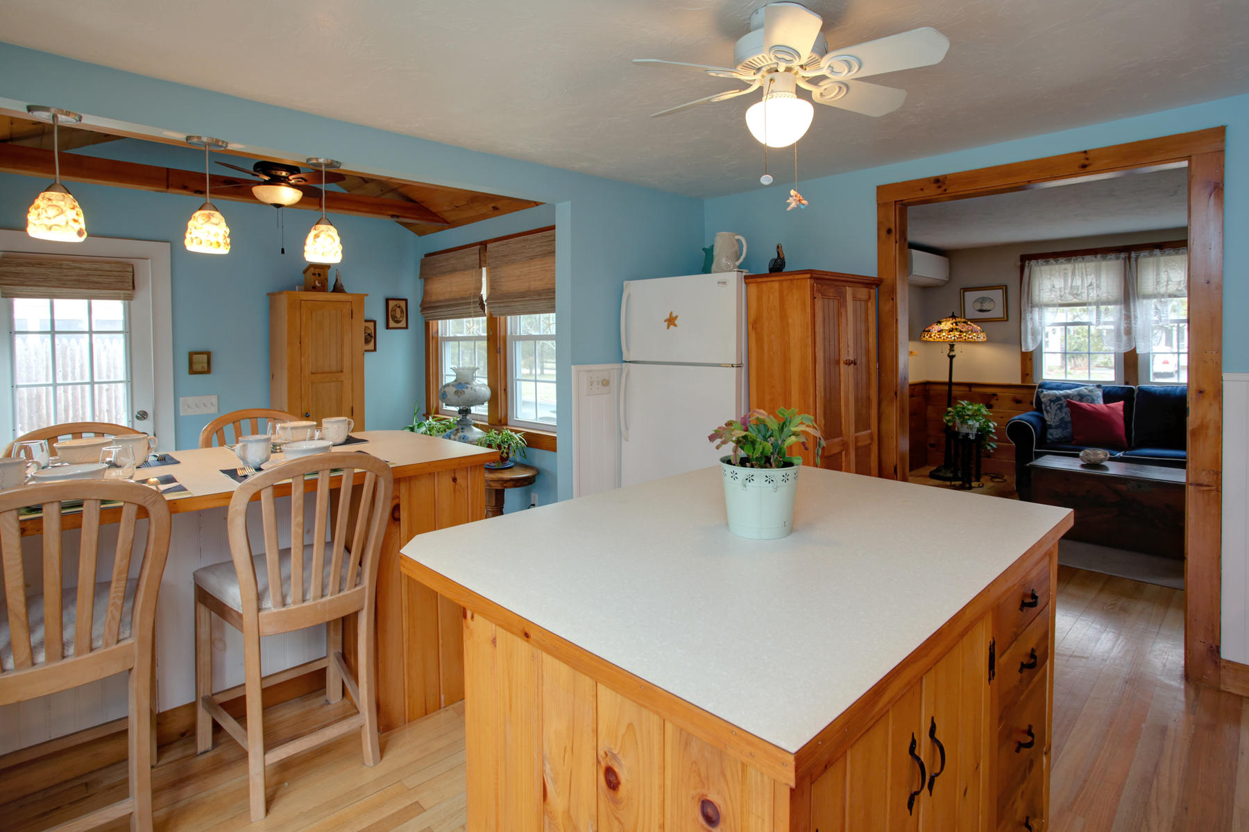 21 Naushon Road Dennis Port, MA 02639 - Photo 7 of 27 a view of a dining room with furniture and wooden floor