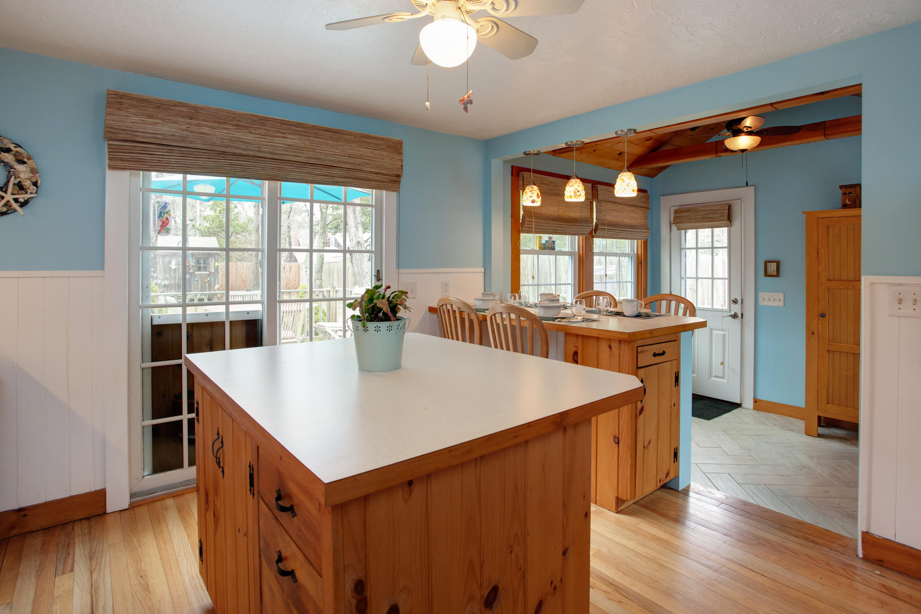 21 Naushon Road Dennis Port, MA 02639 - Photo 9 of 27 a view of kitchen island a sink and wooden floor
