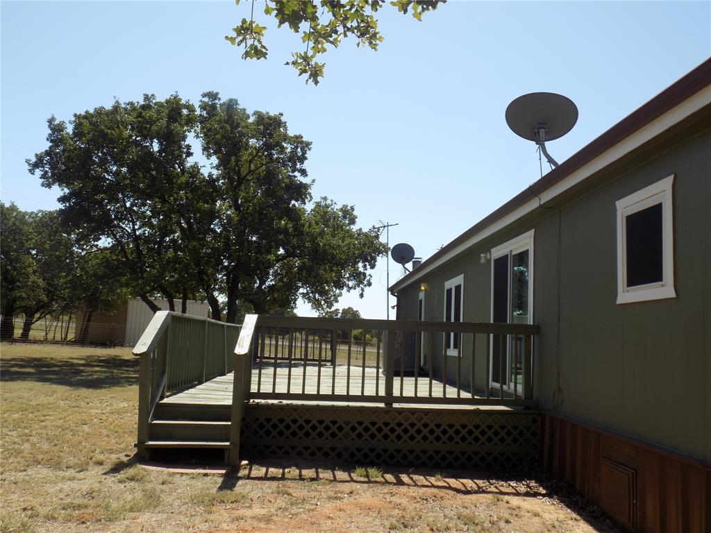 12792 Highway 199 Poolville, TX 76487 - Photo 5 of 24 Hugh back door deck