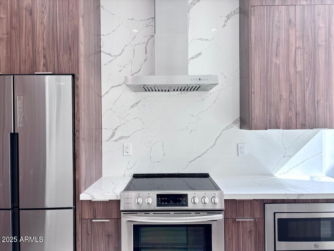 4050 North 12th Street, Unit 6 Phoenix, AZ 85014 - Photo 11 of 50 a stove top oven sitting inside of a kitchen