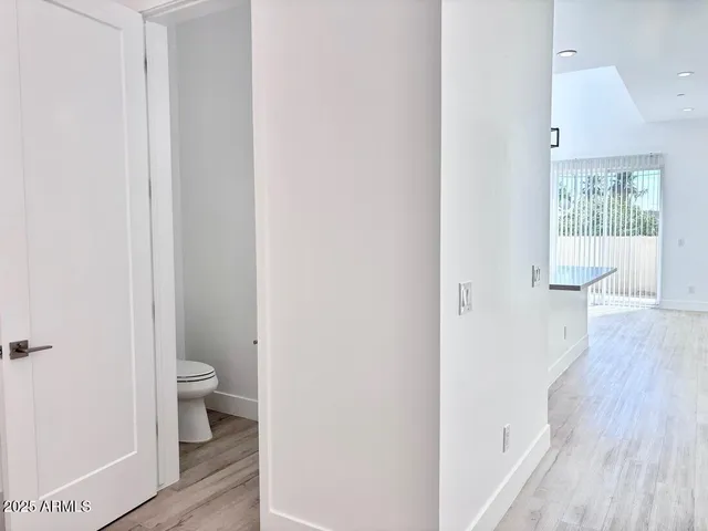 a view of a bathroom from a hallway