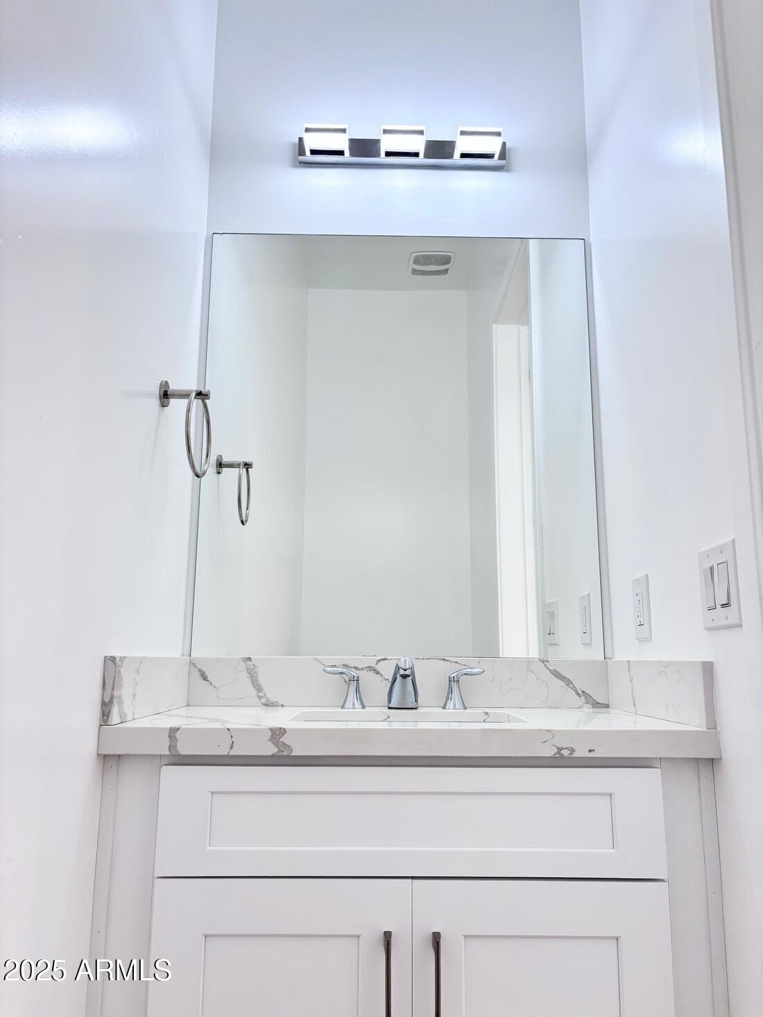 4050 North 12th Street, Unit 6 Phoenix, AZ 85014 - Photo 17 of 50 a bathroom with a sink and a mirror