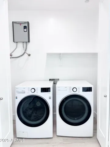a utility room with dryer and washer