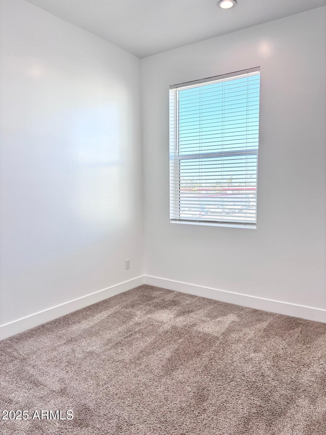 4050 North 12th Street, Unit 6 Phoenix, AZ 85014 - Photo 28 of 50 an empty room with a window