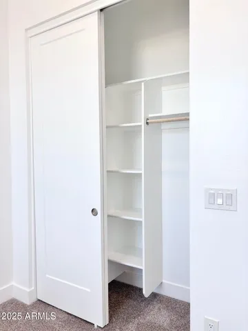 a view of an empty walk in closet