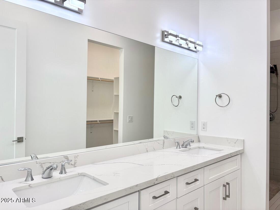 4050 North 12th Street, Unit 6 Phoenix, AZ 85014 - Photo 41 of 50 a bathroom with a granite countertop sink and a mirror