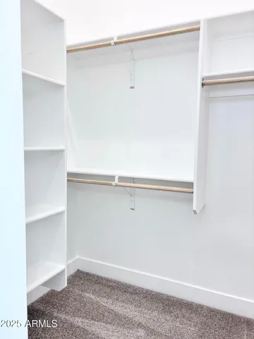 a view of an empty walk in closet