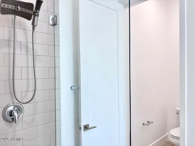 a bathroom with a glass shower door