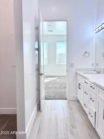 a bathroom with a sink a mirror and a bathtub