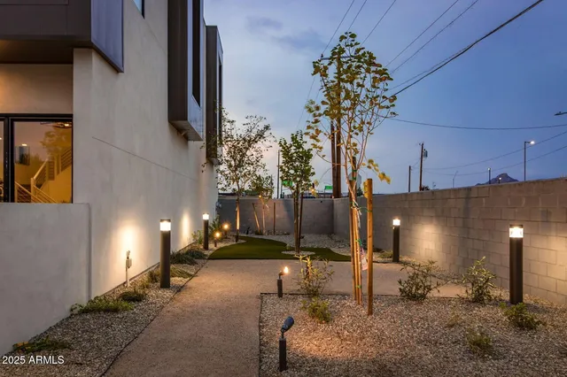 a lobby with furniture and chandelier