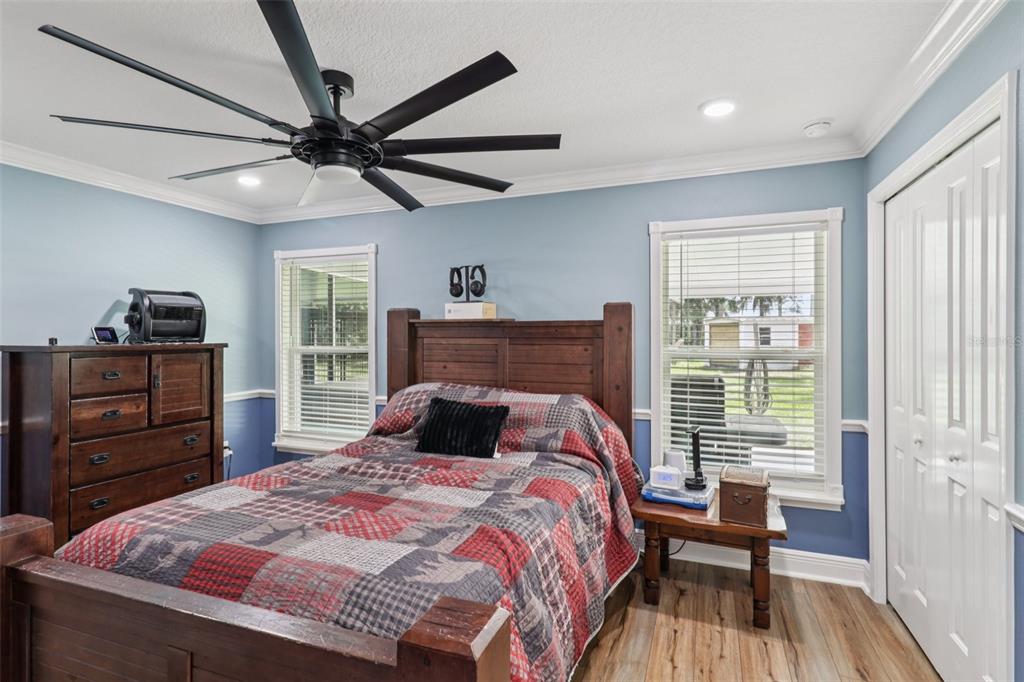 40535 Louise Road Umatilla, FL 32784 - Photo 12 of 38 a bedroom with a bed and a dresser