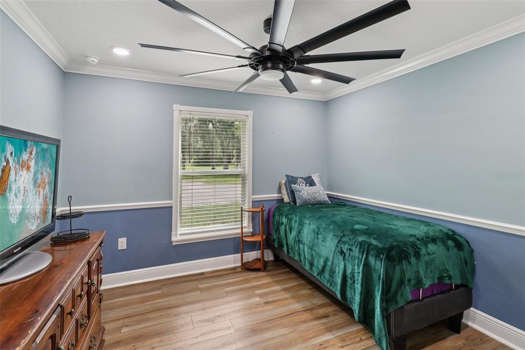 40535 Louise Road Umatilla, FL 32784 - Photo 18 of 38 a room with window and a wooden floor