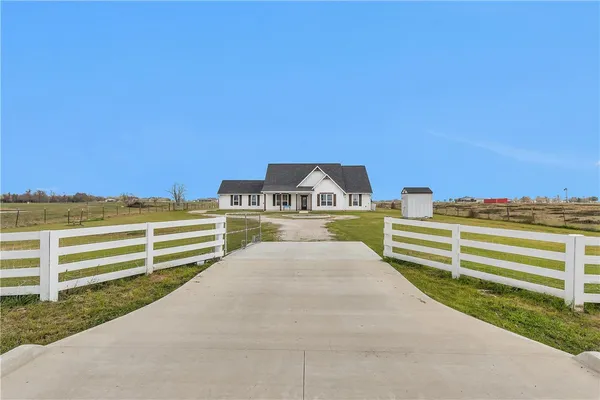 a view of a big room with wooden fence