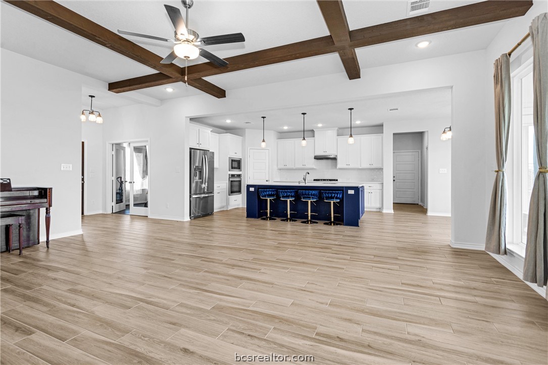 36244 Cochran Road Waller, TX 77484 - Photo 11 of 41 a view of a kitchen with a sink and a refrigerator