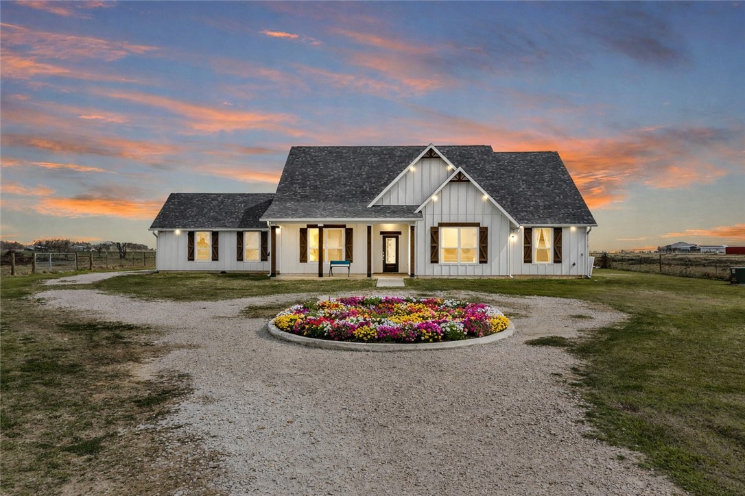 36244 Cochran Road Waller, TX 77484 - Photo 2 of 41 a front view of a house with a garden