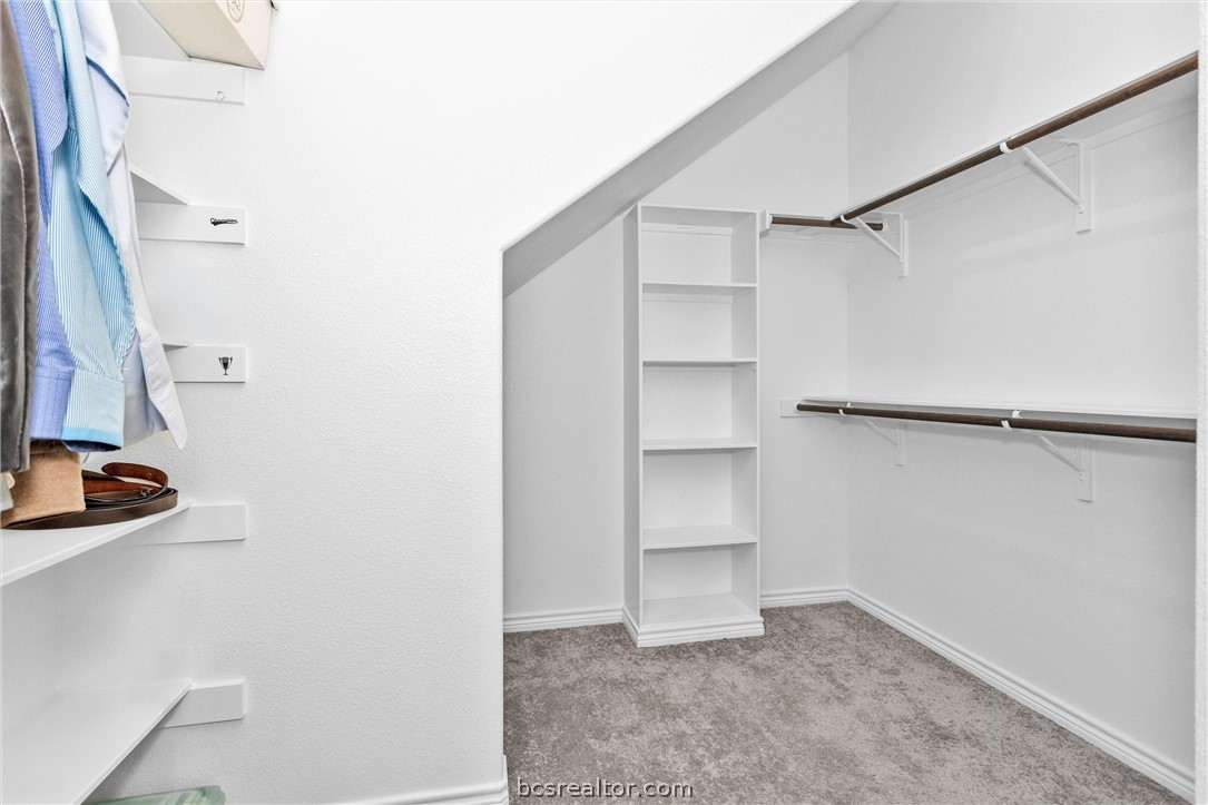 36244 Cochran Road Waller, TX 77484 - Photo 22 of 41 a view of closet area with empty racks