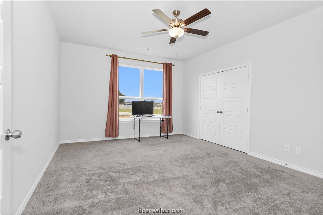 36244 Cochran Road Waller, TX 77484 - Photo 24 of 41 a view of a livingroom with a ceiling fan and a window