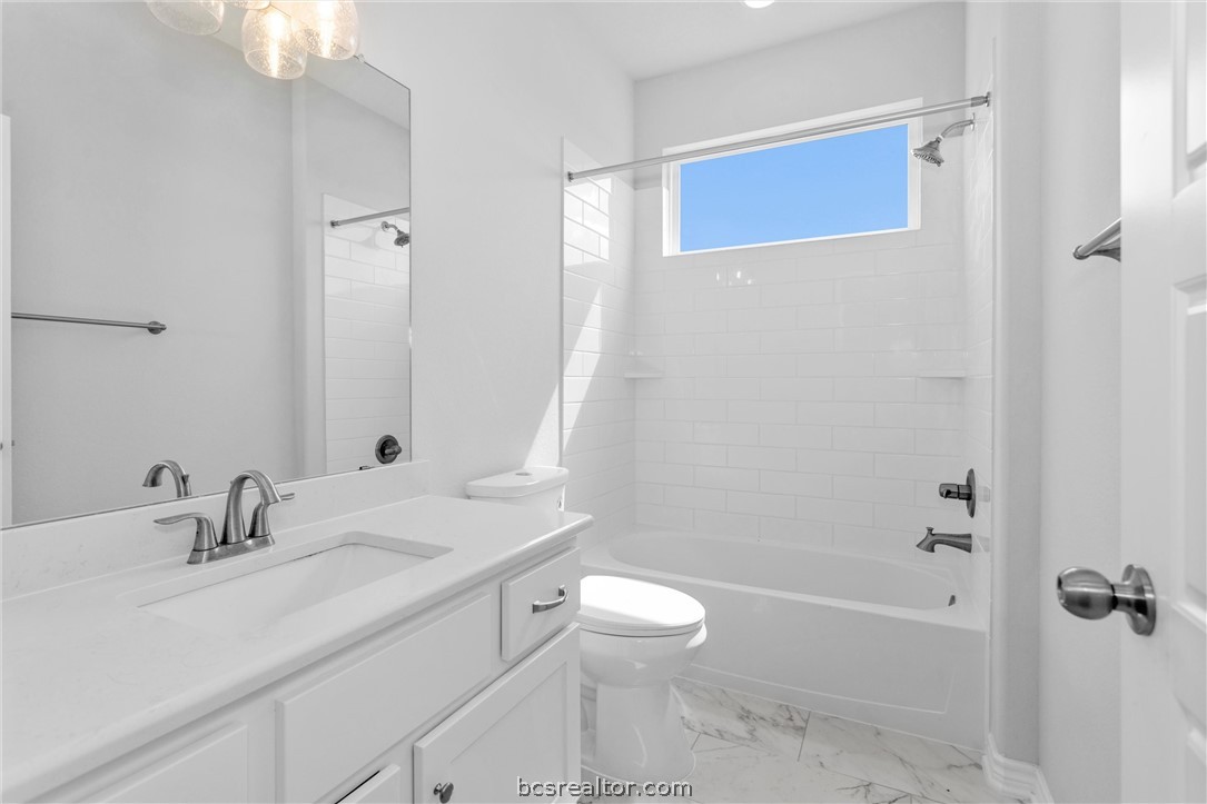36244 Cochran Road Waller, TX 77484 - Photo 25 of 41 a bathroom with a sink a toilet and shower