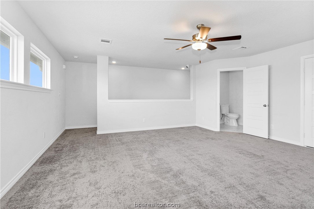 36244 Cochran Road Waller, TX 77484 - Photo 28 of 41 a view of an empty room with a ceiling fan