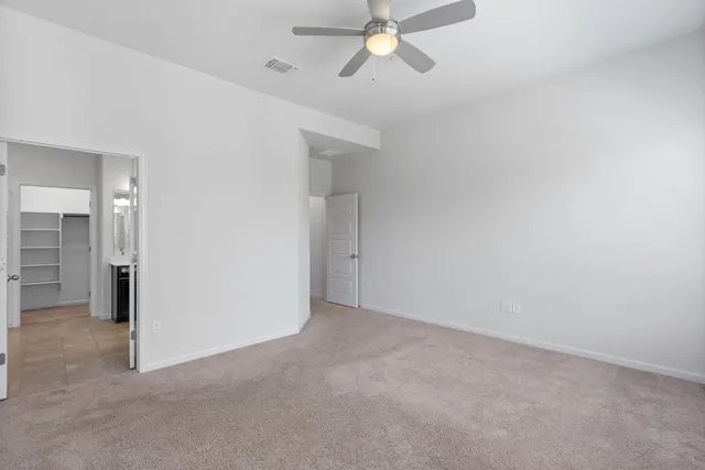 an empty room with fan