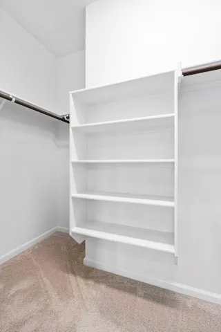 a view of an empty walk in closet