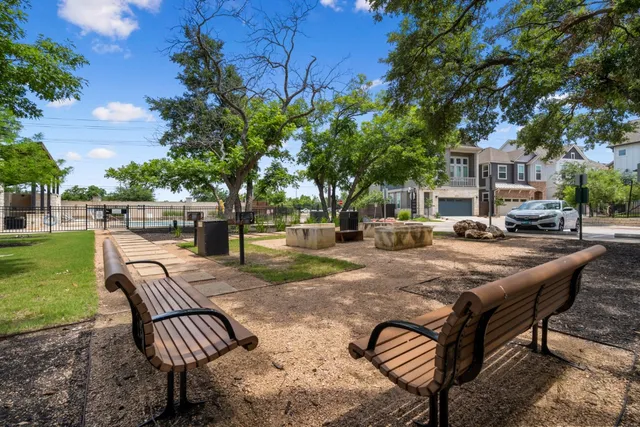 a view of patio with chairs and tables