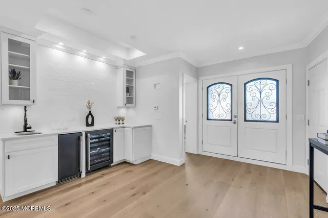 a kitchen with a sink a counter and cabinets