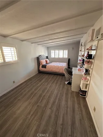 a bathroom with a toilet a sink and a mirror