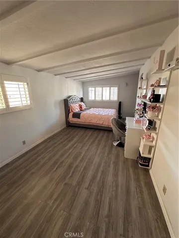 a bathroom with a toilet a sink and a mirror