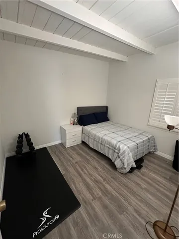 a bathroom with a sink toilet a mirror and shower