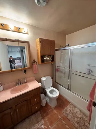 a view of a porch with furniture and a yard