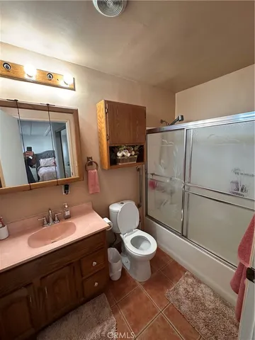 a view of a porch with furniture and a yard