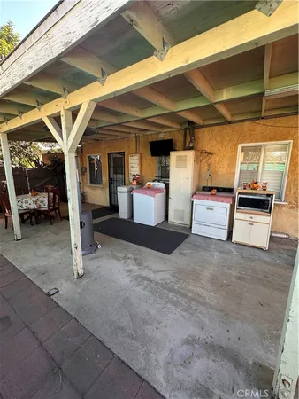 a view of a backyard with table and chairs