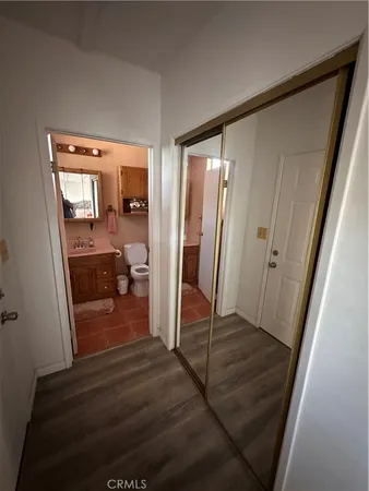 a view of a livingroom from a hallway