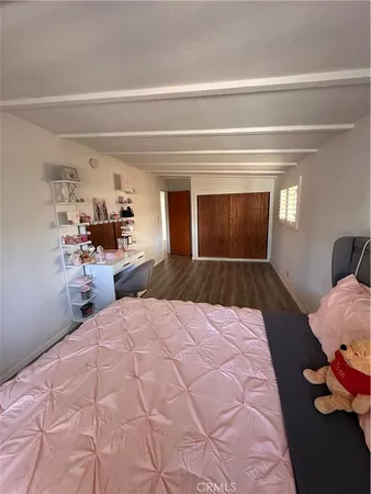 a bed room with a bed and a window