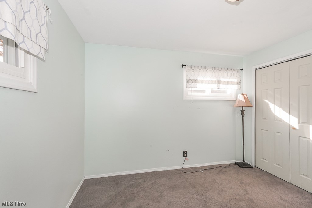 1127 Garden Road Willoughby, OH 44094 - Photo 16 of 33 Unfurnished bedroom featuring light colored carpet and a closet