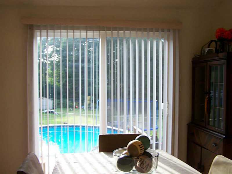 319 Lewis Road Greensburg, PA 15601 - Photo 12 of 21 Dining Room. Showing the sliding door from the dining room out to the deck, & above ground pool