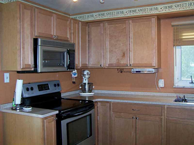 319 Lewis Road Greensburg, PA 15601 - Photo 4 of 21 Kitchen. Partial view of kitchen showing the beautiful maple cabinets, & the solid surface counters