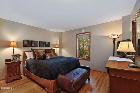 3630 South Massbach Road Stockton, IL 61085 - Photo 11 of 25 a bedroom with a bed and wooden floor