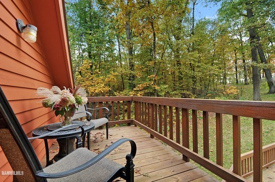 3630 South Massbach Road Stockton, IL 61085 - Photo 22 of 25 a balcony with wooden floor and outdoor seating