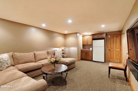 3630 South Massbach Road Stockton, IL 61085 - Photo 6 of 25 a living room with furniture and a refrigerator