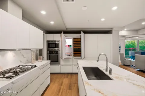 a bedroom with a bed and a table
