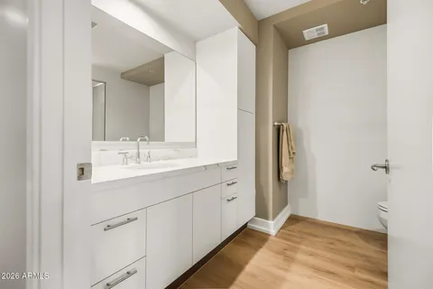 a view of a room with wooden floor
