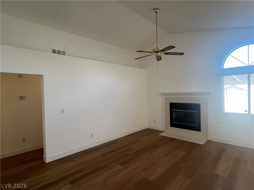 1309 Goldenglow Road Las Vegas, NV 89108 - Photo 3 of 11 A well-proportioned living area features a stately fireplace and appealing wood flooring.