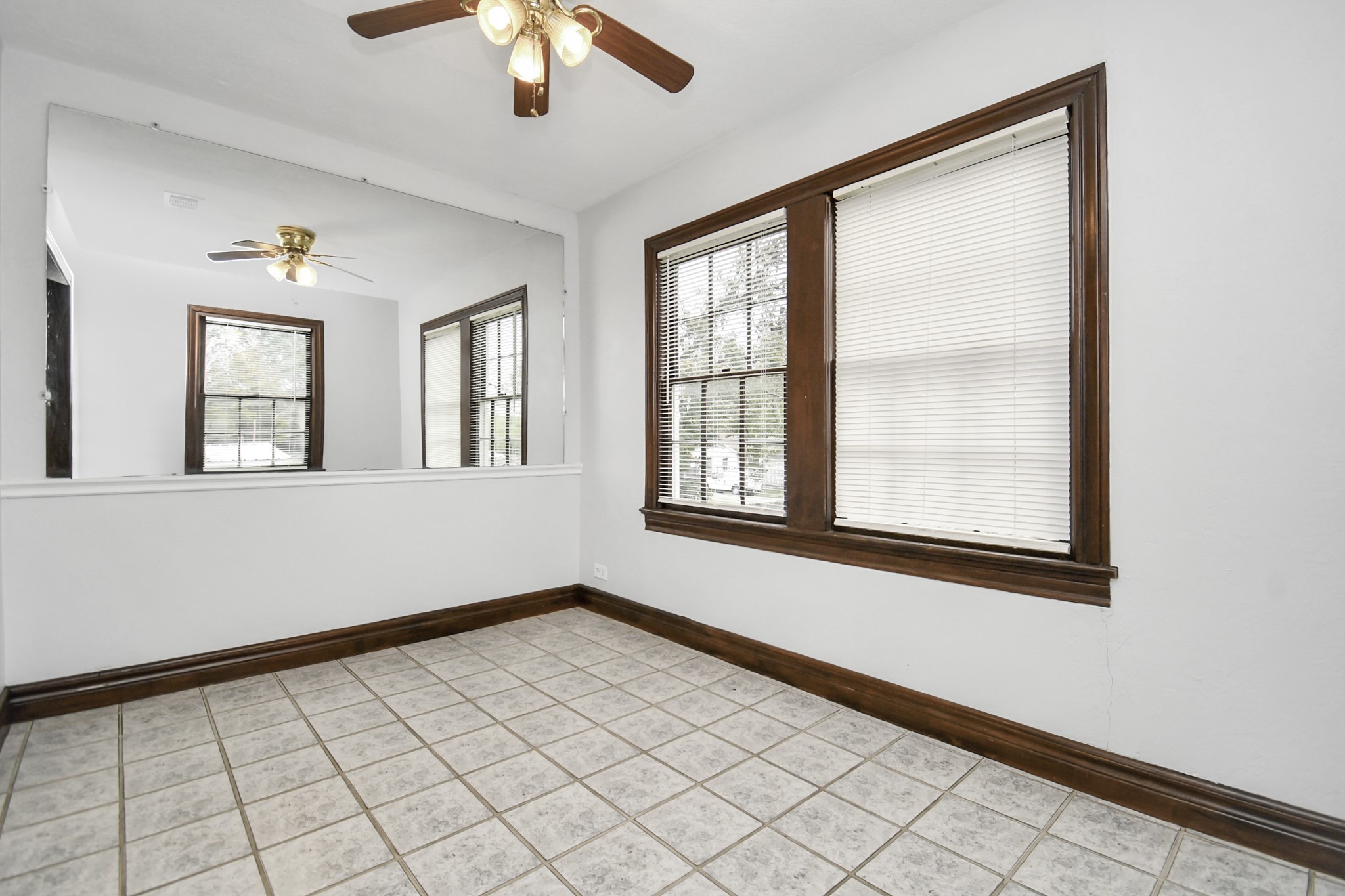 109 Amundsen Street Houston, TX 77009 - Photo 21 of 40 a view of an empty room with window and chandelier fan