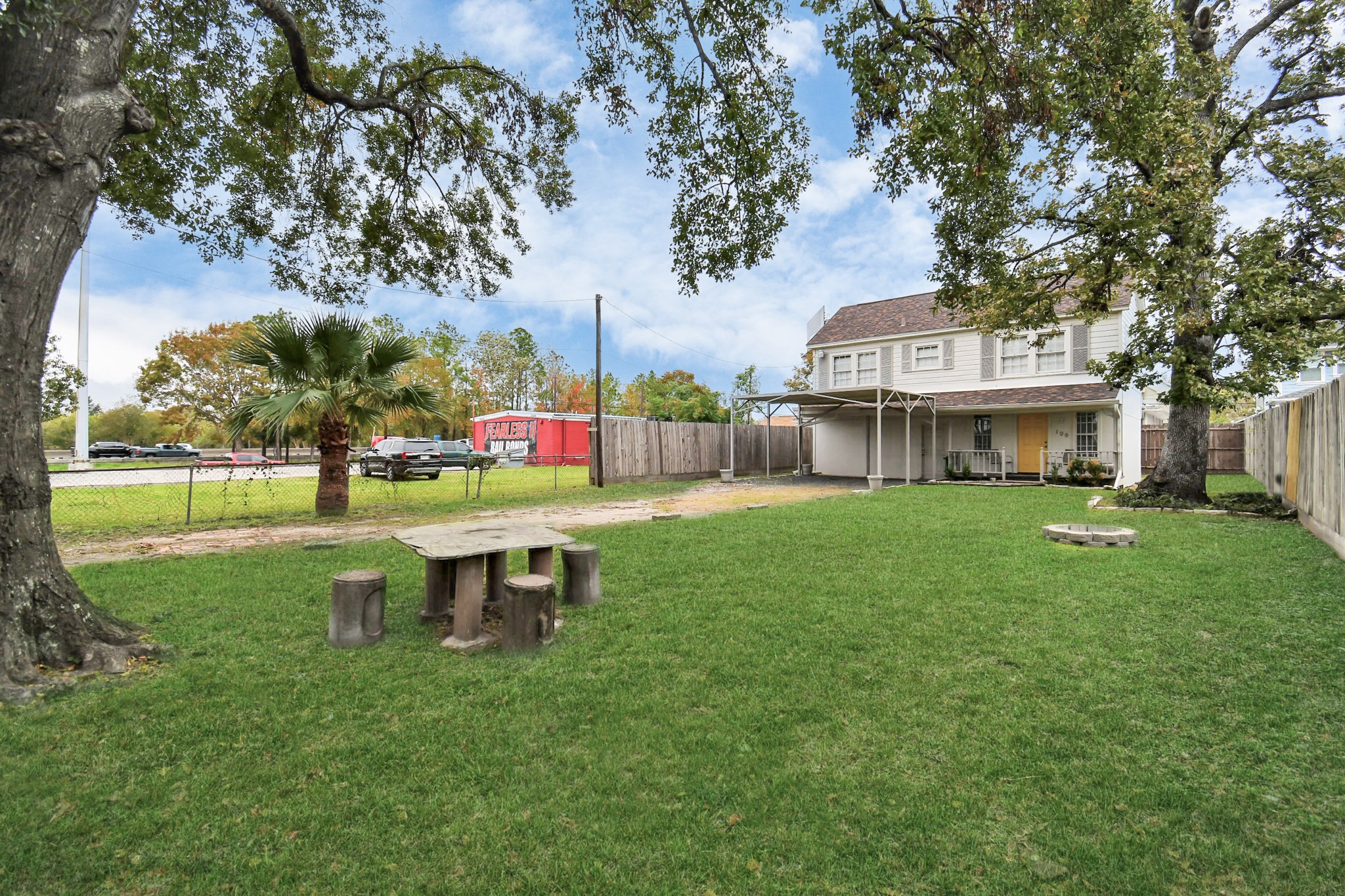 109 Amundsen Street Houston, TX 77009 - Photo 29 of 40 a view of a house with a yard potted plants and large tree