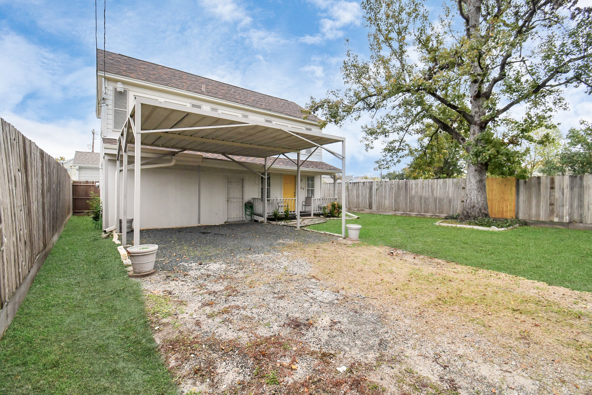 109 Amundsen Street Houston, TX 77009 - Photo 31 of 40 a view of a backyard with large tree