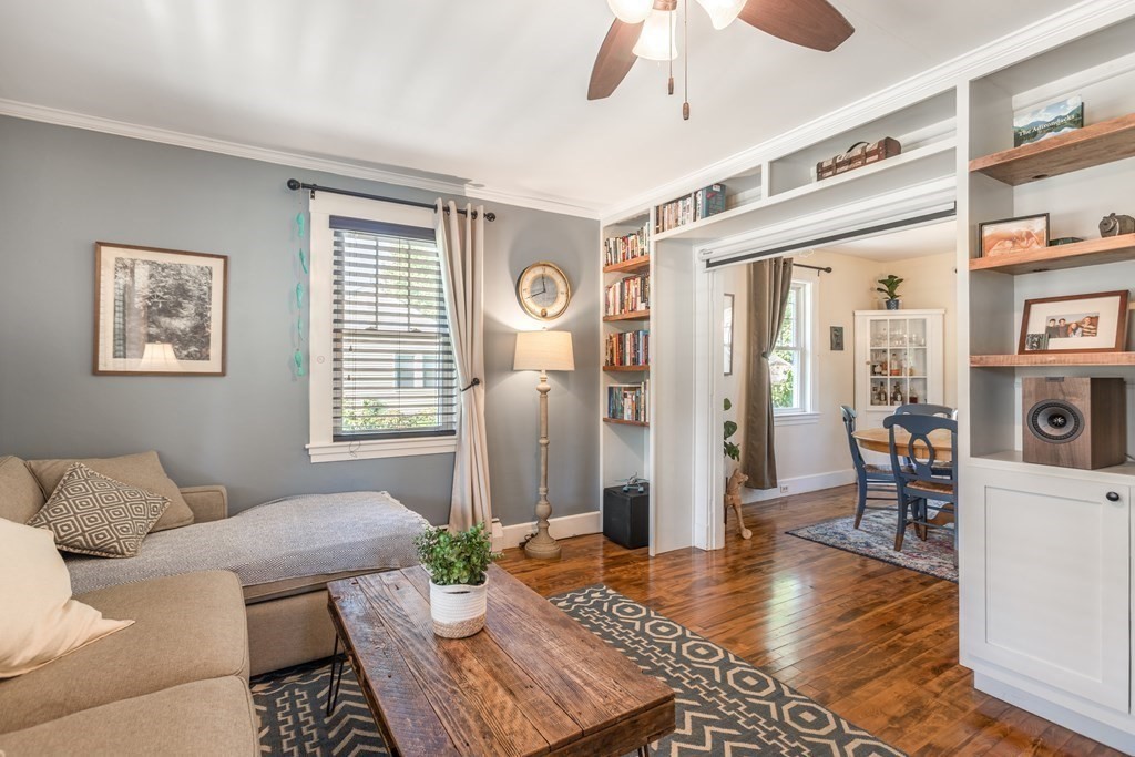 7 Charles Street Maynard, MA 01754 - Photo 12 of 33 a living room with furniture and a window